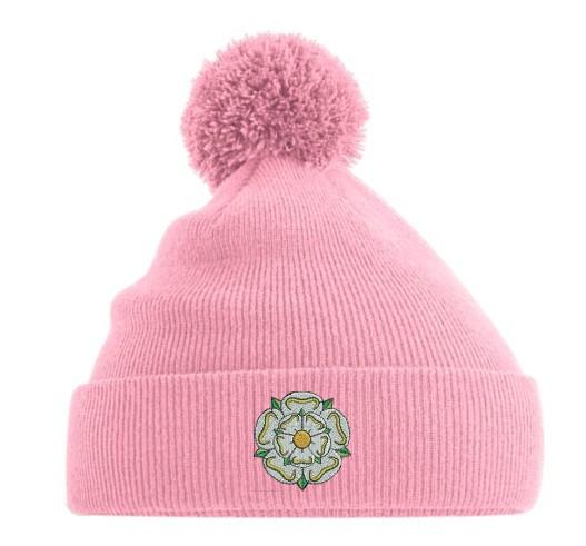 pink bobble hat with yorkshire rose on the cuff