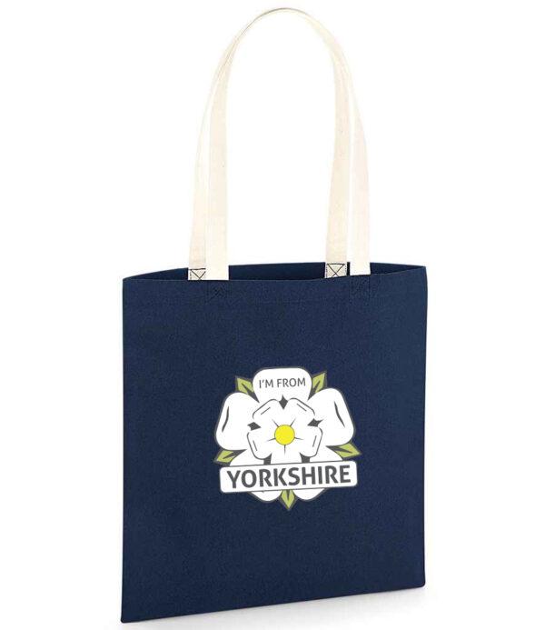 Navy tote back with natural straps and the I'm From Yorkshire logo on the front centre