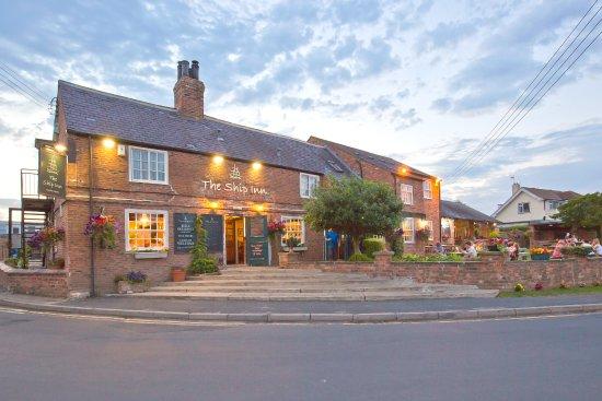 The Ship Inn in Acaster Malbis with its outside lights on.